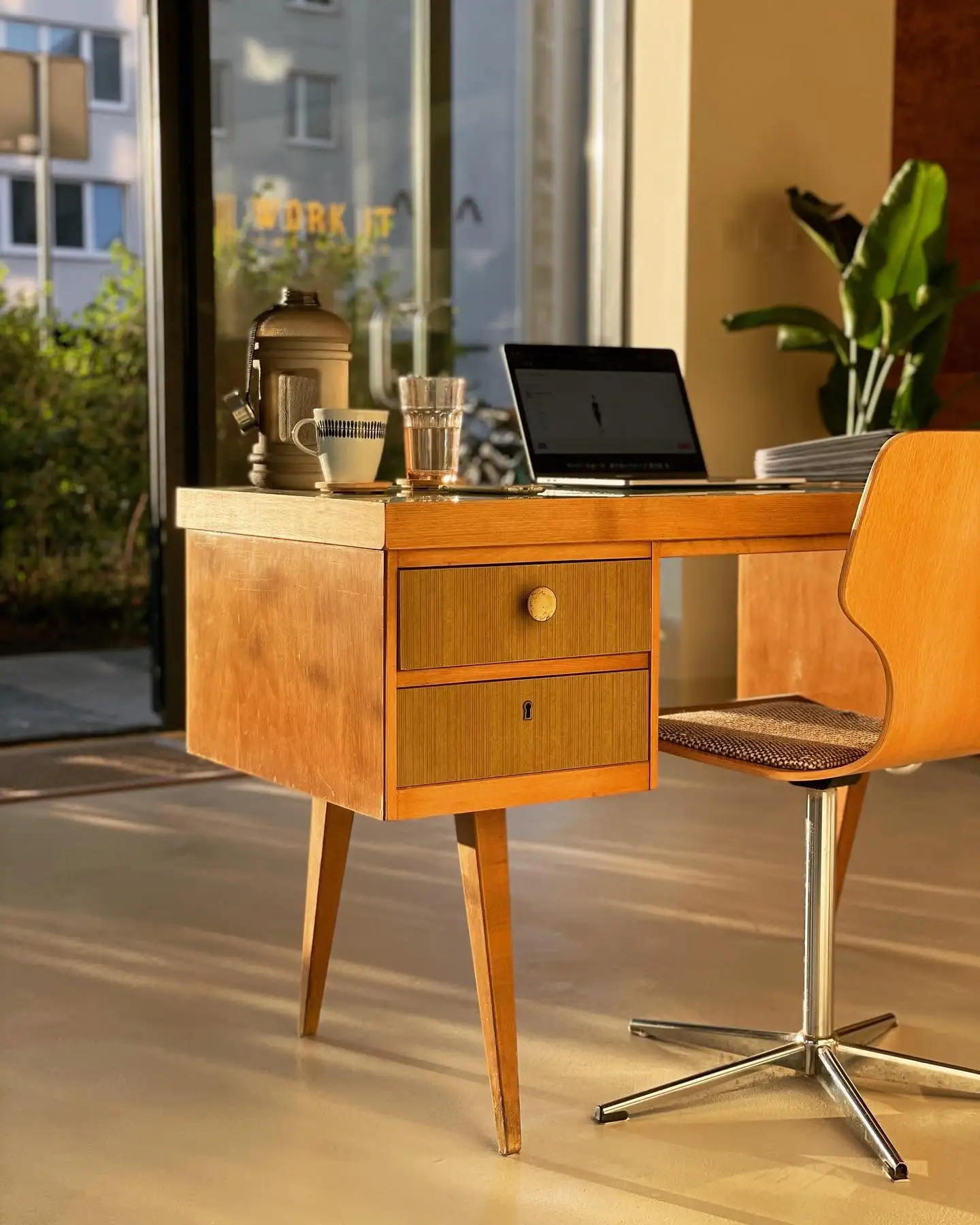 The reception desk at the WorkItEMS studio in warm evening light